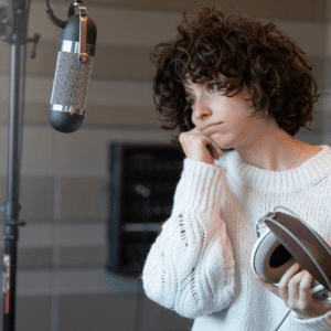 singer-looking-discouraged-as-she-looks-at-microphone